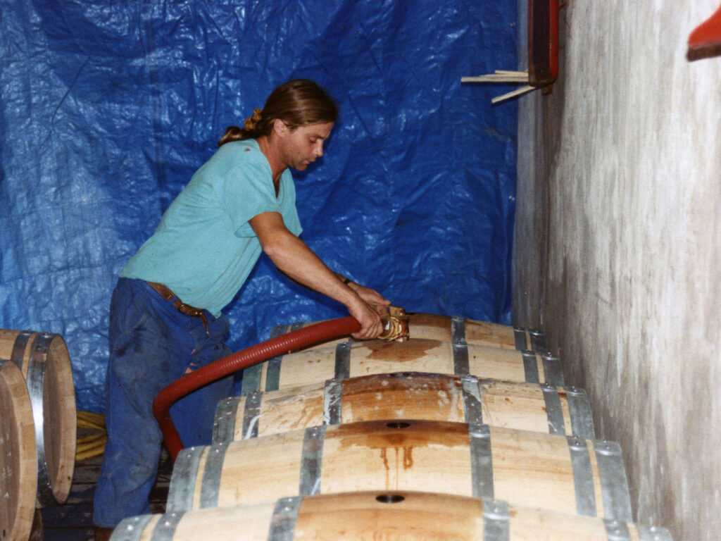 Image of Stephan filling barrels